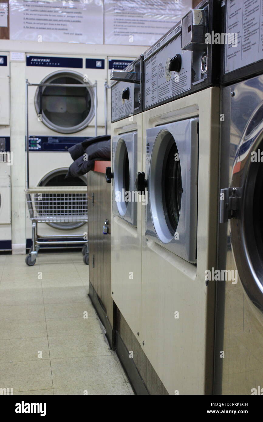 Washing machines and dryers at the local laundromat that still has