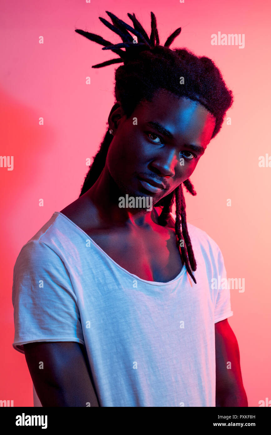 African Man Portrait Under Blue And Purple Lights Ultraviolet
