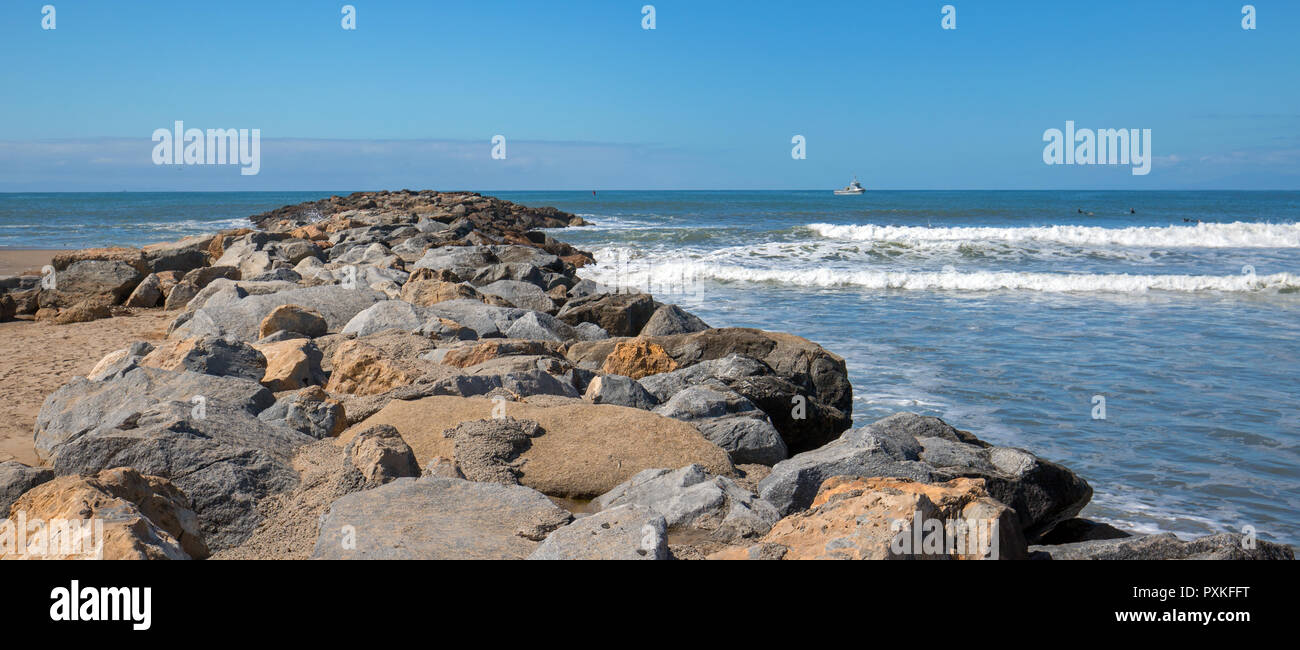 Small fishing boat at the entrance to Ventura Harbor on California's