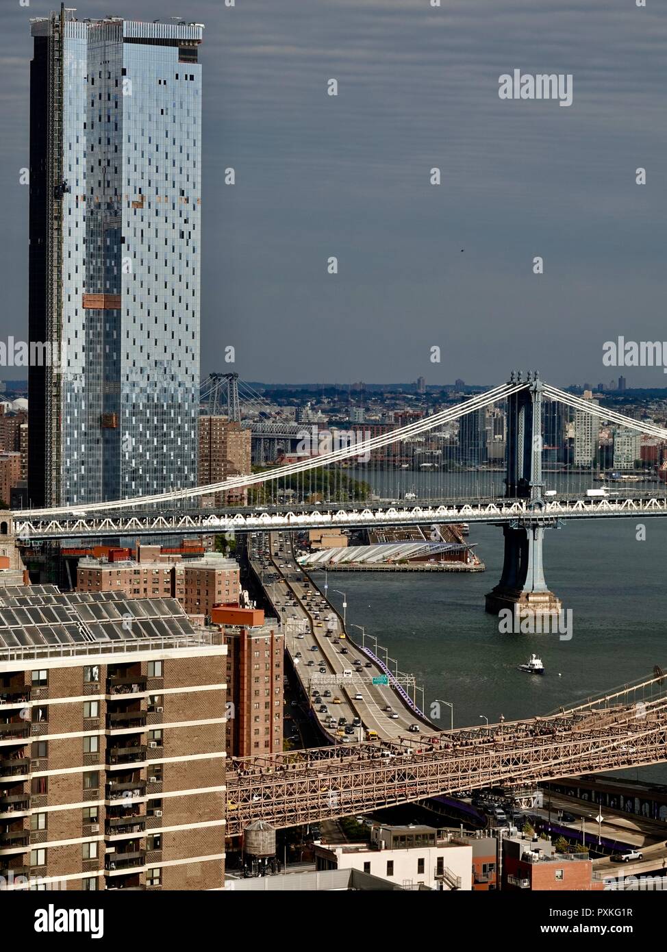 Rooftop view of the Brooklyn and Manhattan bridges, the FDR Parkway, and the East River, Lower