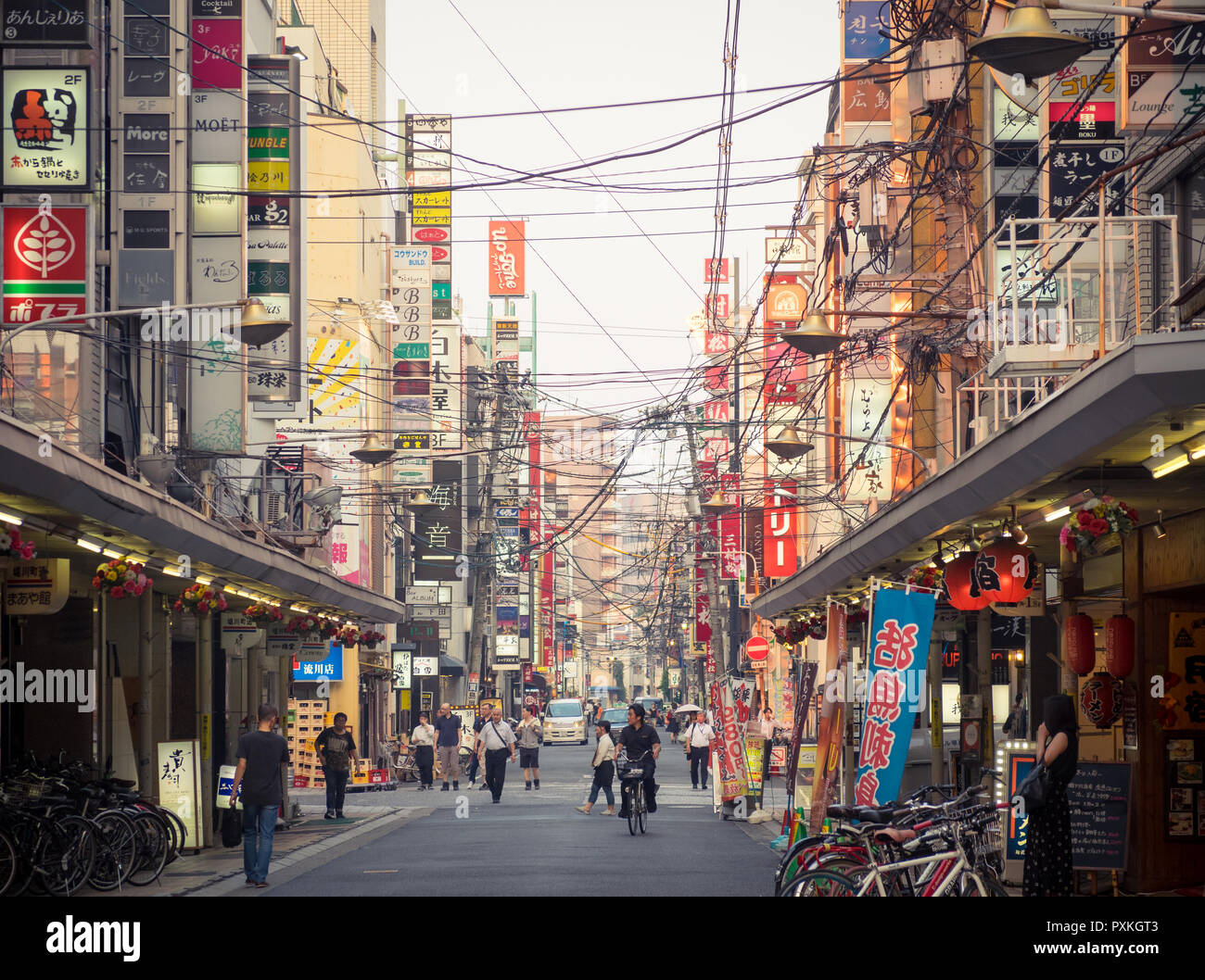 A street scene with shops, signs, and people from the Horikawa District (Horikawa-cho) of Hiroshima, Japan. Stock Photo