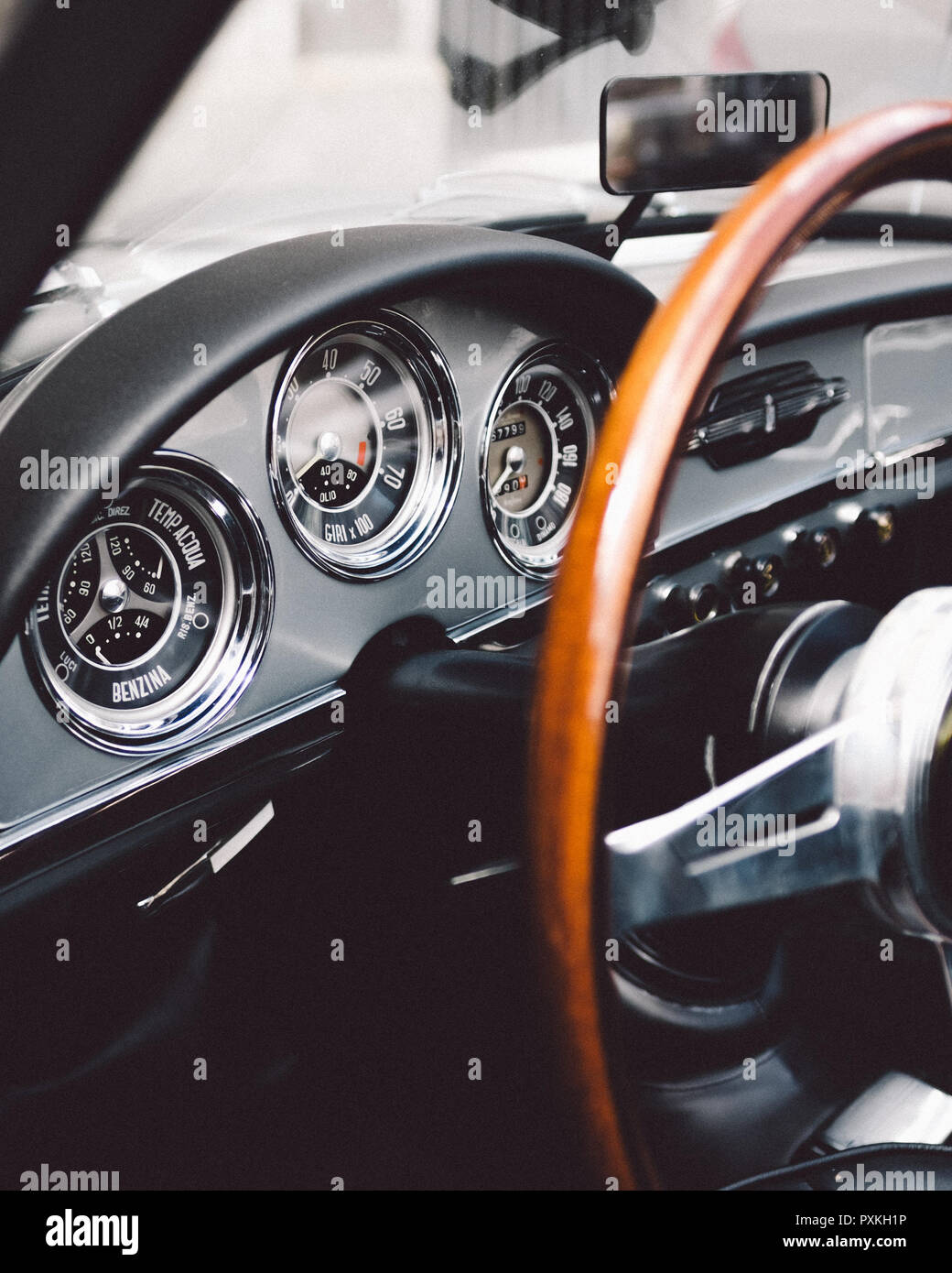 Interior Of Old Classic Car With Big Wooden Steering Wheel