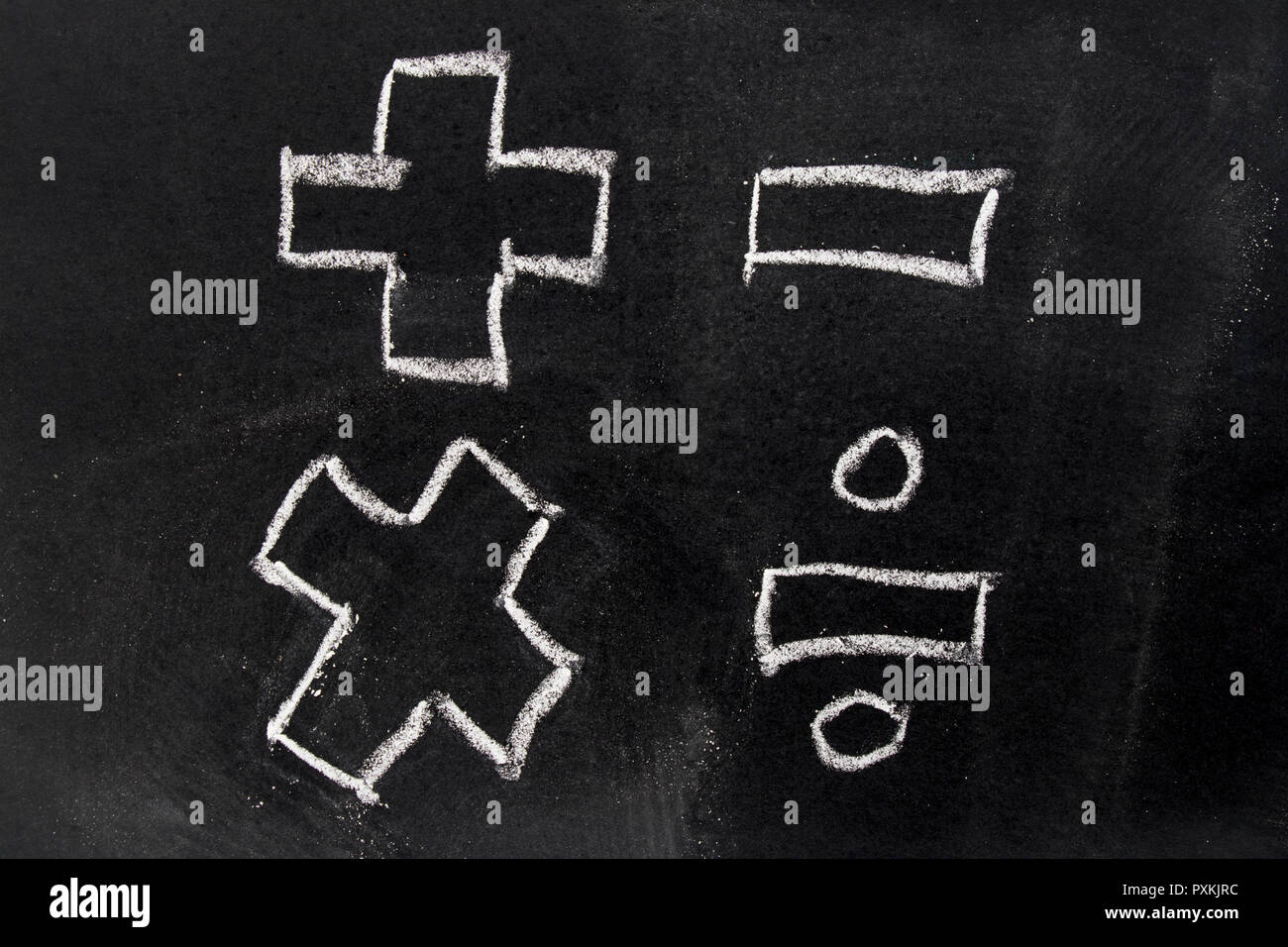 White chalk drawing in basic mathematics symbol (plus minus multiply  divide) on black board background Stock Photo - Alamy
