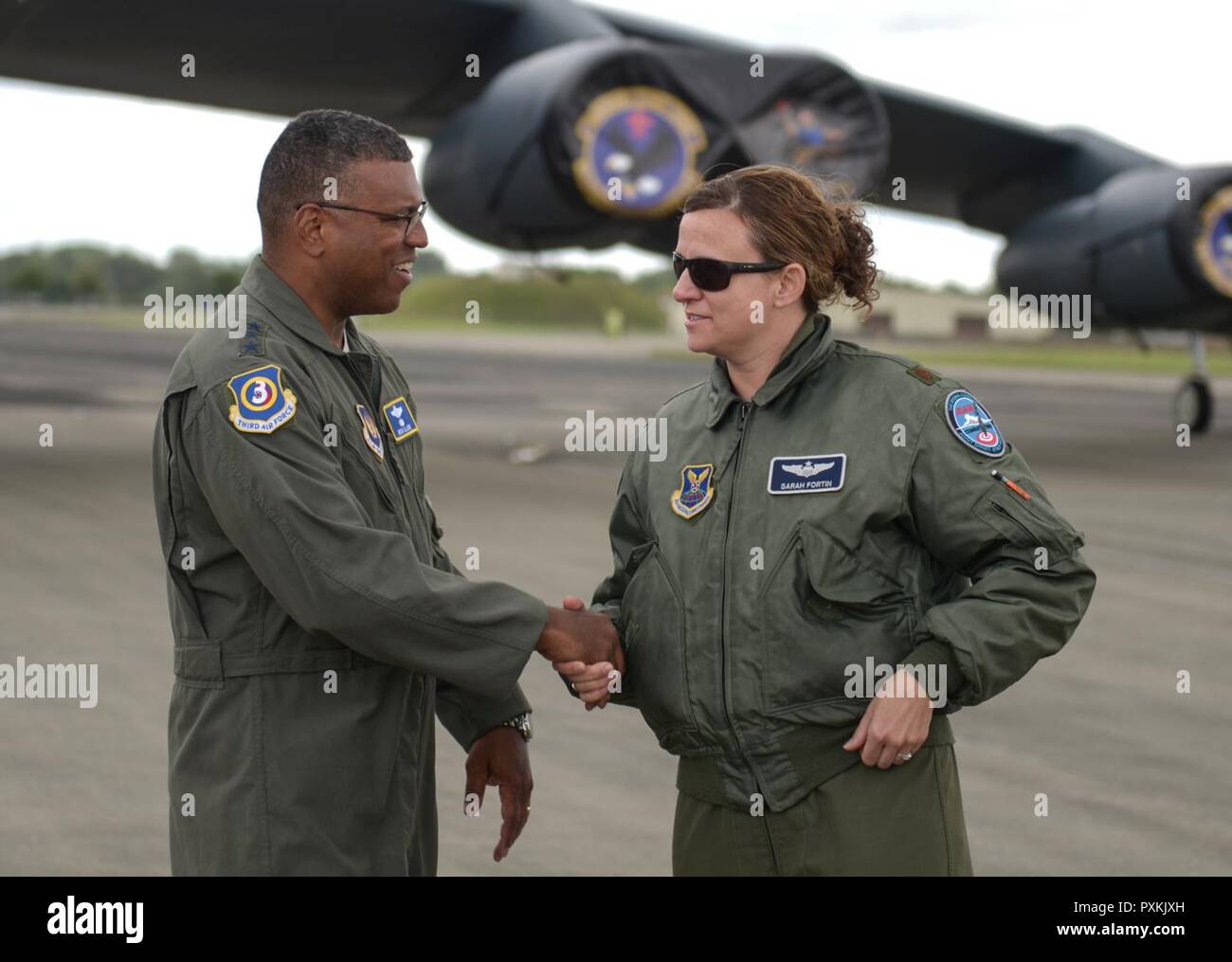 Lt. Gen. Richard Clark, 3rd Air Force commander, shakes the hand of an Air Force Global Strike Command Airman deployed to RAF Fairford, June 12, 2017. The simultaneous deployment of the B-1B Lancer, the B-2 Spirit and the B-52H Stratofortress marked the first time in history that all three strategic bomber aircraft were present in the European Theater. The aircraft were accompanied by approximately 800 Airmen as part of bomber assurance and deterrence operations. Stock Photo
