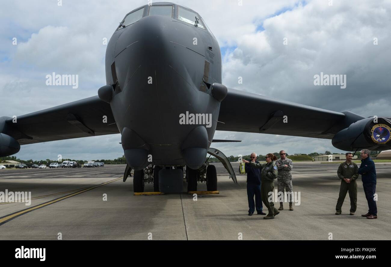 Distinguished visitors and local officials near RAF Fairford stand beside a B-52H Stratofortress during a tour of all three Air Force Global Strike Command strategic bombers during their historic, simultaneous deployment to the European Theater June 12, 2017. Visitors were allowed up-close access to unique and capable weapon systems showcasing how U.S. Airmen support NATO allies and partners. The B-52H Stratofortress, B-1B Lancer, and B-2 Spirit are accompanied by approximately 800 Airmen to support bomber assurance and deterrence operations. Stock Photo