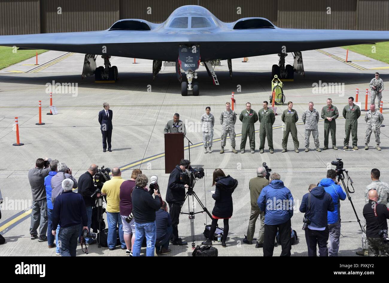 Lt. Gen. Richard Clark, 3rd Air Force commander, addresses news reporters in front of a 'tri-bomber' formation of a B-52H Stratofortress, a B-1B Lancer and a B-2 Spirit, during a media day event at RAF Fairford, U.K., June 12, 2017.  The event marked the first time in history that all three of Air Force Global Strike Command's strategic bomber aircraft simultaneously deployed to the European Theater as part of bomber assurance and deterrence operations. The forward presence of bomber aircraft and Airmen assists in maintaining high readiness for global reach capabilities. Stock Photo