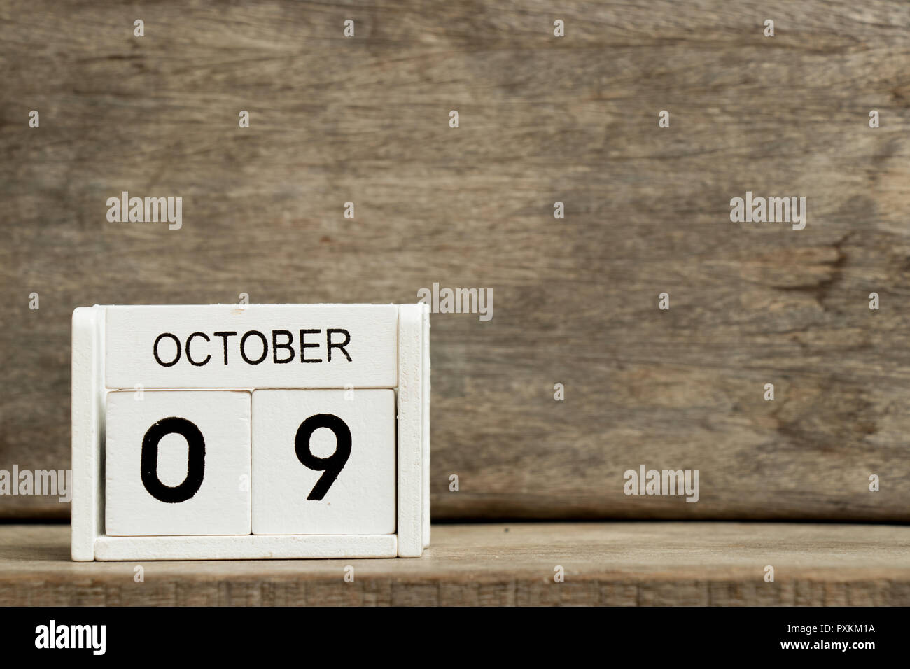 White block calendar present date 9 and month October on wood background (Day of fire prevention, hangul in south korea) Stock Photo
