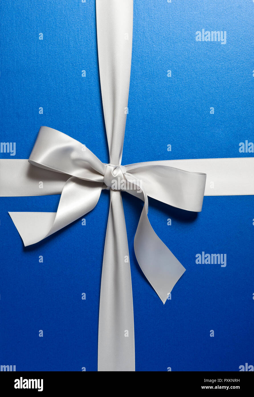 A present wrapped in blue paper and silver ribbon Stock Photo