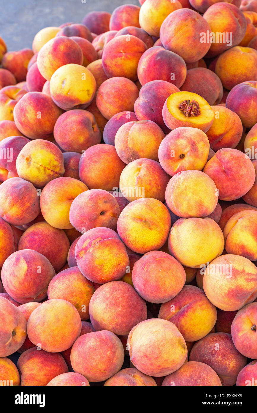 Fresh peaches for sale at a market stall in Germany Stock Photo Alamy