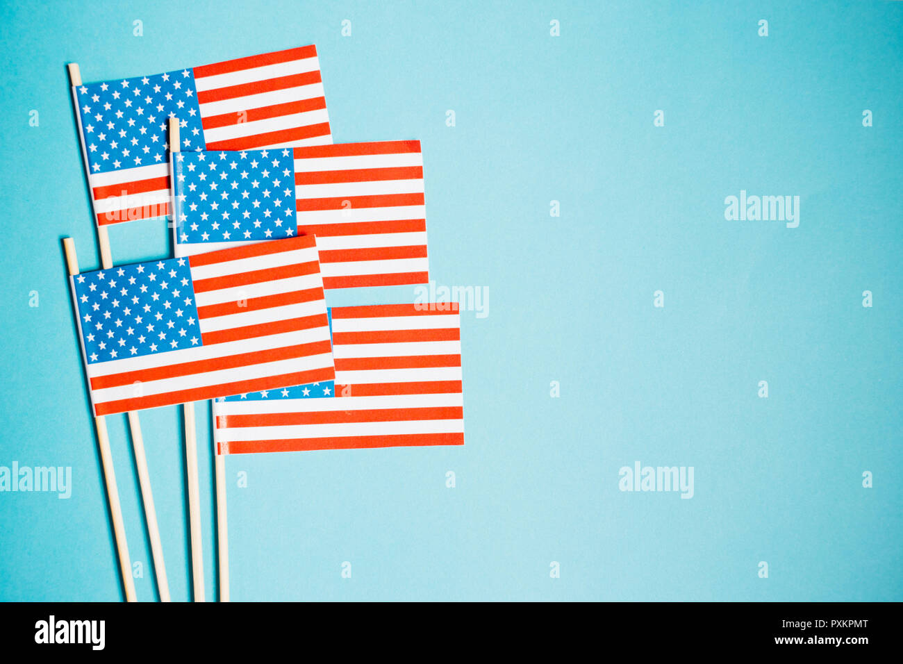Miniature paper flag USA. American Flag on blue background Stock Photo ...