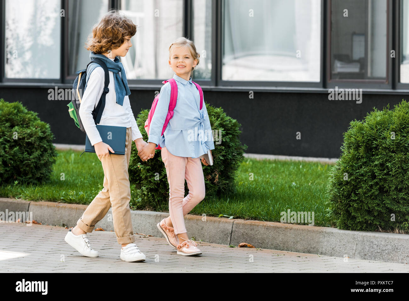 Students holding hands walking hi-res stock photography and images - Alamy