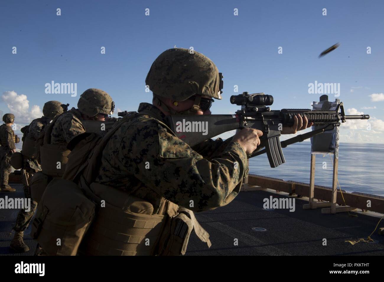 Lance Cpl. Evan Talbott, a military policeman with Combat Logistics Battalion 31, fires an M16A4 service rifle during marksmanship training aboard the USS Bonhomme Richard (LHD 6), June 15, 2017. CLB-31 is permanently assigned to the 31st MEU and provides support for all elements of the MEU. The 31st MEU partners with the Navy’s Amphibious Squadron 11 to form the amphibious component of the Bonhomme Richard Expeditionary Strike Group. The 31st MEU and PHIBRON 11 combine to provide a cohesive blue-green team capable of accomplishing a variety of missions across the Indo-Asia-Pacific region. Stock Photo