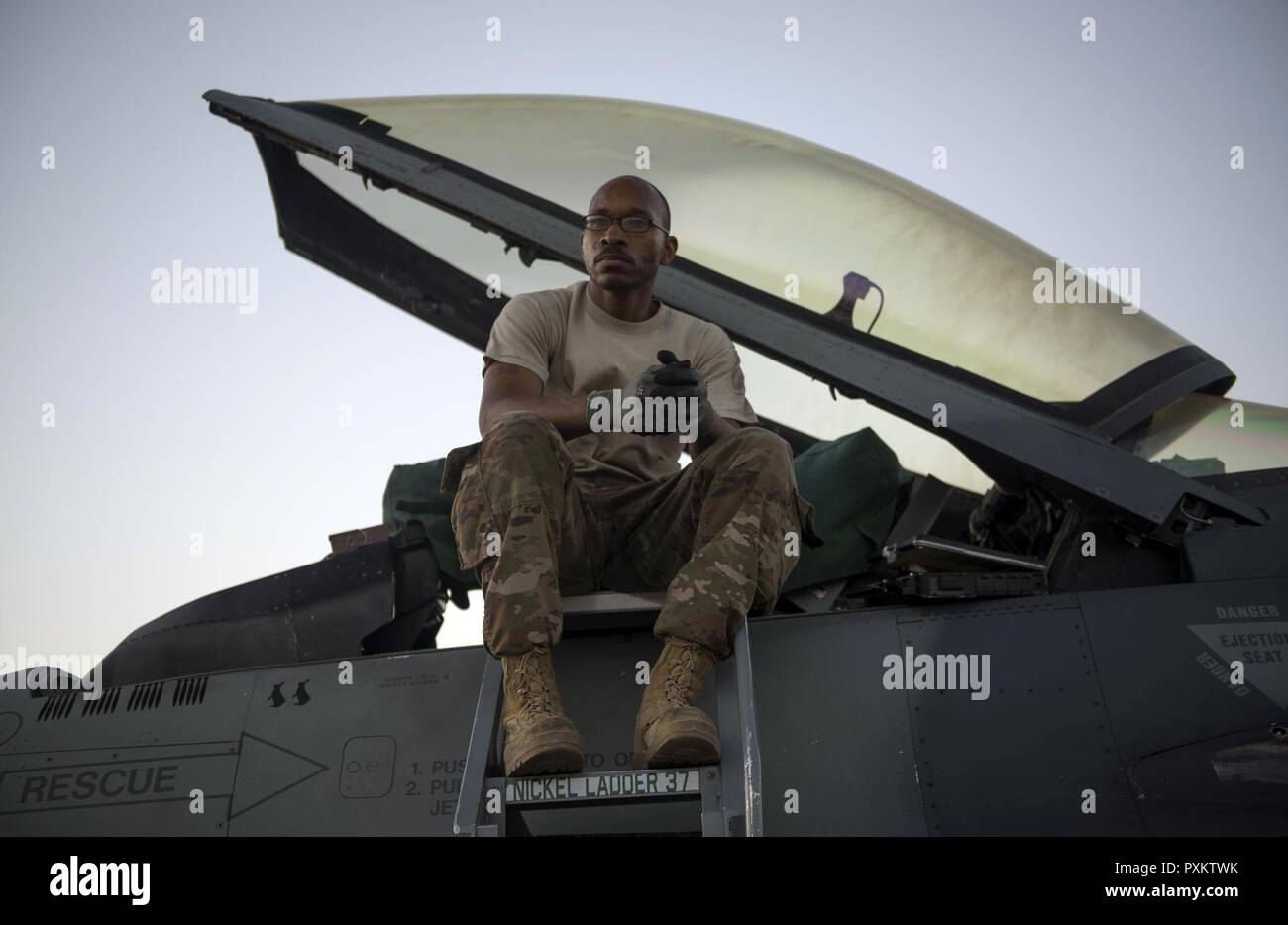 Staff Sgt. Donterrio Erby, a 455th Expeditionary Aircraft Maintenance Squadron aerospace propulsion technician, waits for a piece of equipment before conducting an F-16 Fighting Falcon afterburner run at Bagram Airfield, Afghanistan, June 16, 2017. Erby is deployed out of Aviano Air Base, Italy, where he performs engine maintenance on F-16s assigned to the 555th Expeditionary Fighter Squadron. Stock Photo