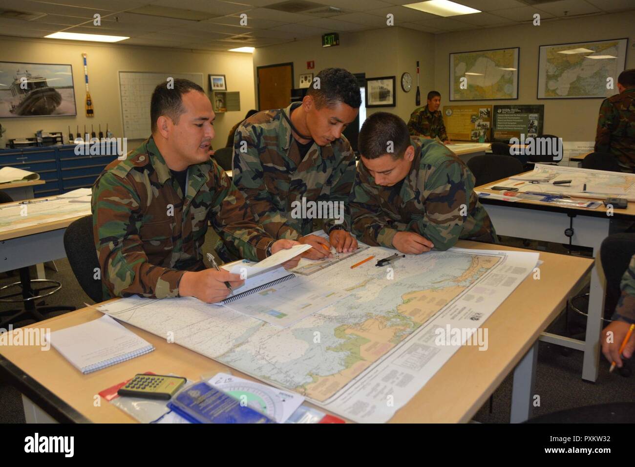 STENNIS SPACE CENTER, Miss. -- International students participating in the Patrol Craft Officer - Coastal Course at the Naval Small Craft Instruction and Technical Training School complete a coastal navigation block of instruction.    The 10 students participating in Class 17-4's iteration of PCO-C are from Colombia, Costa Rica, El Salvador, Honduras, Nicaragua and Peru.    PCO-C is an eight-week maritime course of instruction designed to provide personnel with the knowledge and skills to operate coastal patrol craft in a patrol setting in accordance with approved doctrine.  Course topics incl Stock Photo