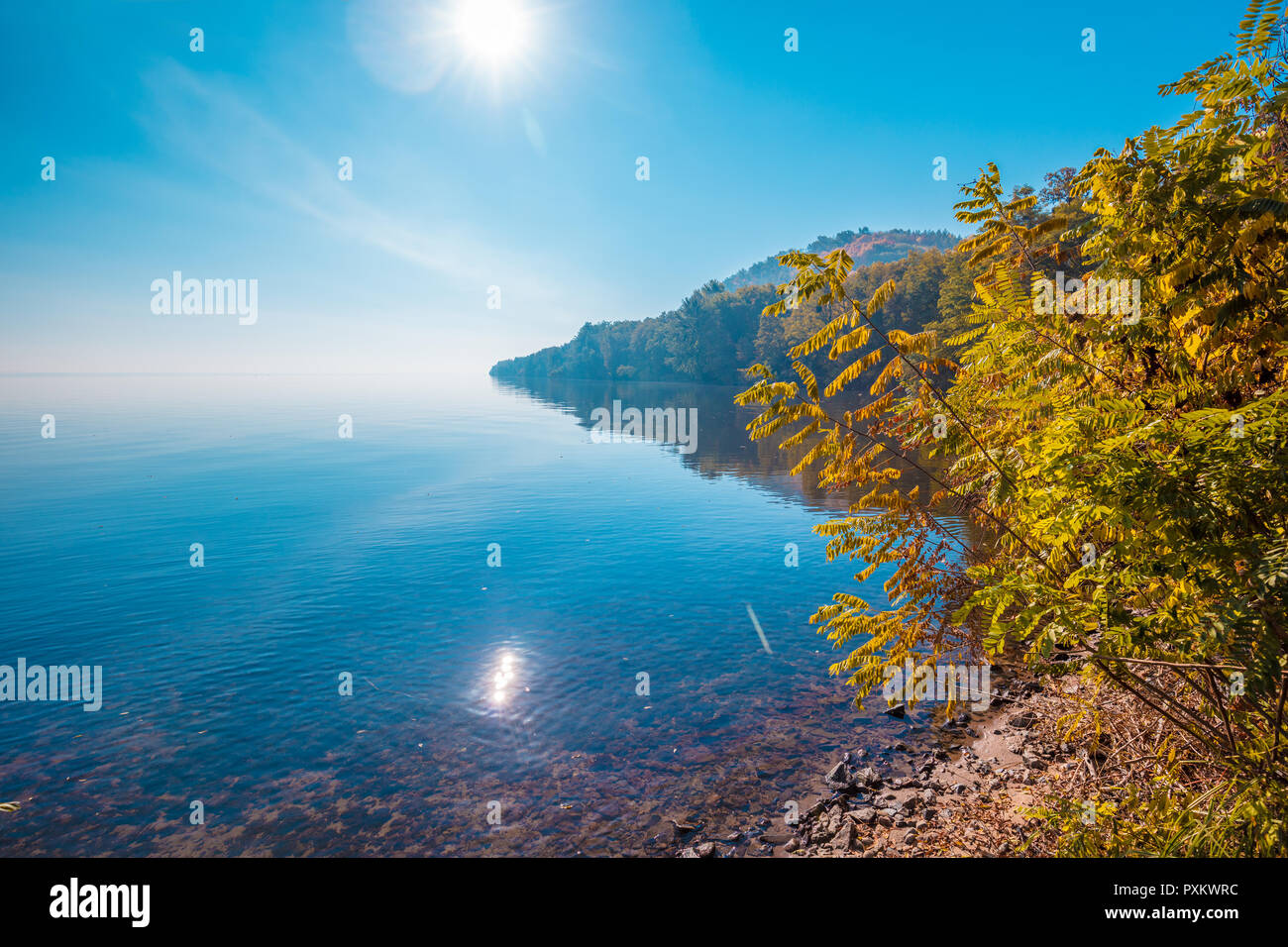 Cape and bay in a misty autumn morning Stock Photo