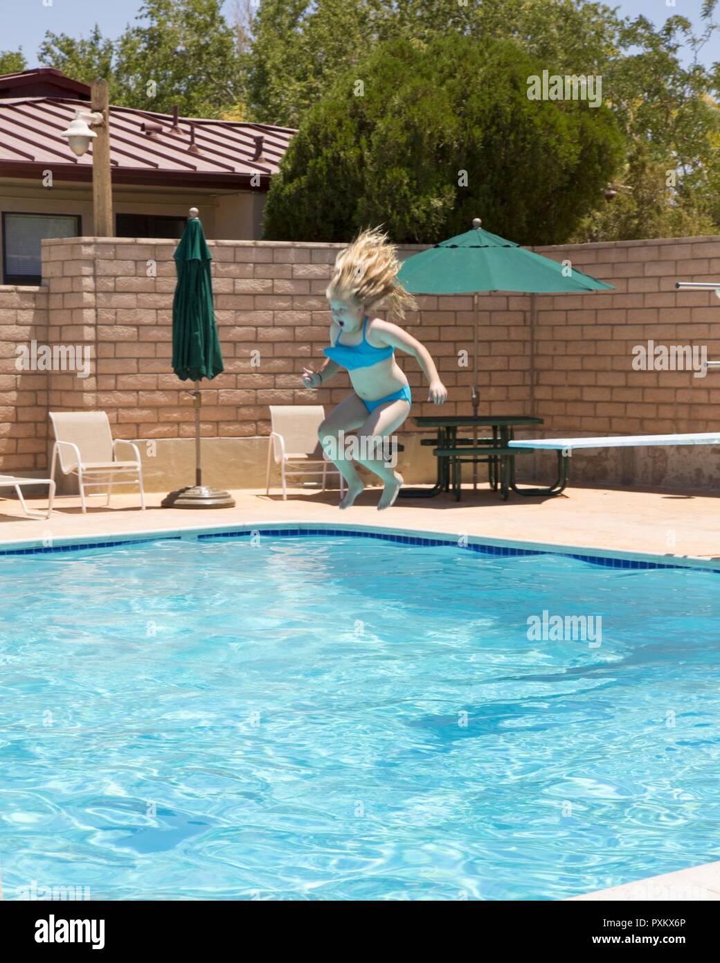 Chloe Bledsoe Takes A Plunge Off The Diving Board At The Oasis Pool And Water Park During The School Age Care Summer Camp Held Aboard Marine Corps Logistics Base Barstow Calif June
