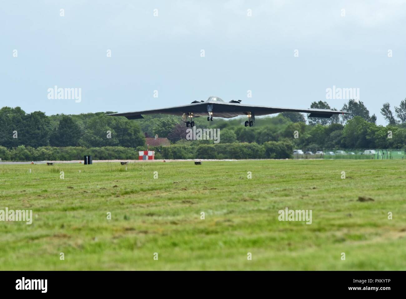 A B-2 Spirit deployed from Whiteman Air Force Base, Mo., approaches the runway at RAF Fairford, U.K., June 9, 2017. The B-2 routinely conducts bomber assurance and deterrence missions providing a flexible and vigilant long-range global strike capability, and is just one demonstration of the U.S. commitment to supporting global security. Stock Photo