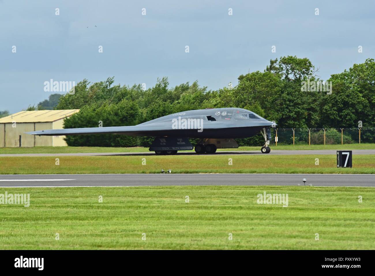 A B-2 Spirt deployed from Whiteman Air Force Base, Mo., approaches the runway at RAF Fairford, U.K., June 9, 2017. The B-2 routinely conducts bomber assurance and deterrence missions providing a flexible and vigilant long-range global strike capability, and is just one demonstration of the U.S. commitment to supporting global security. Stock Photo
