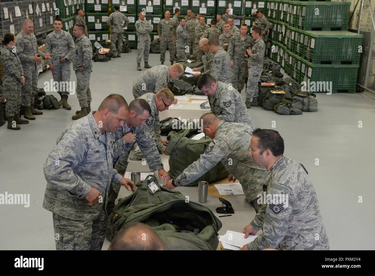 U.S. Air Force 119th Wing unit members, on the left side of the tables ...