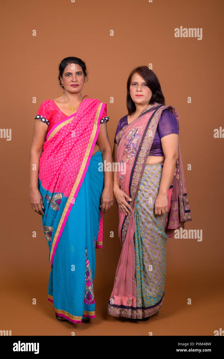 Two Mature Indian Women Wearing Sari Indian Traditional Clothes Stock