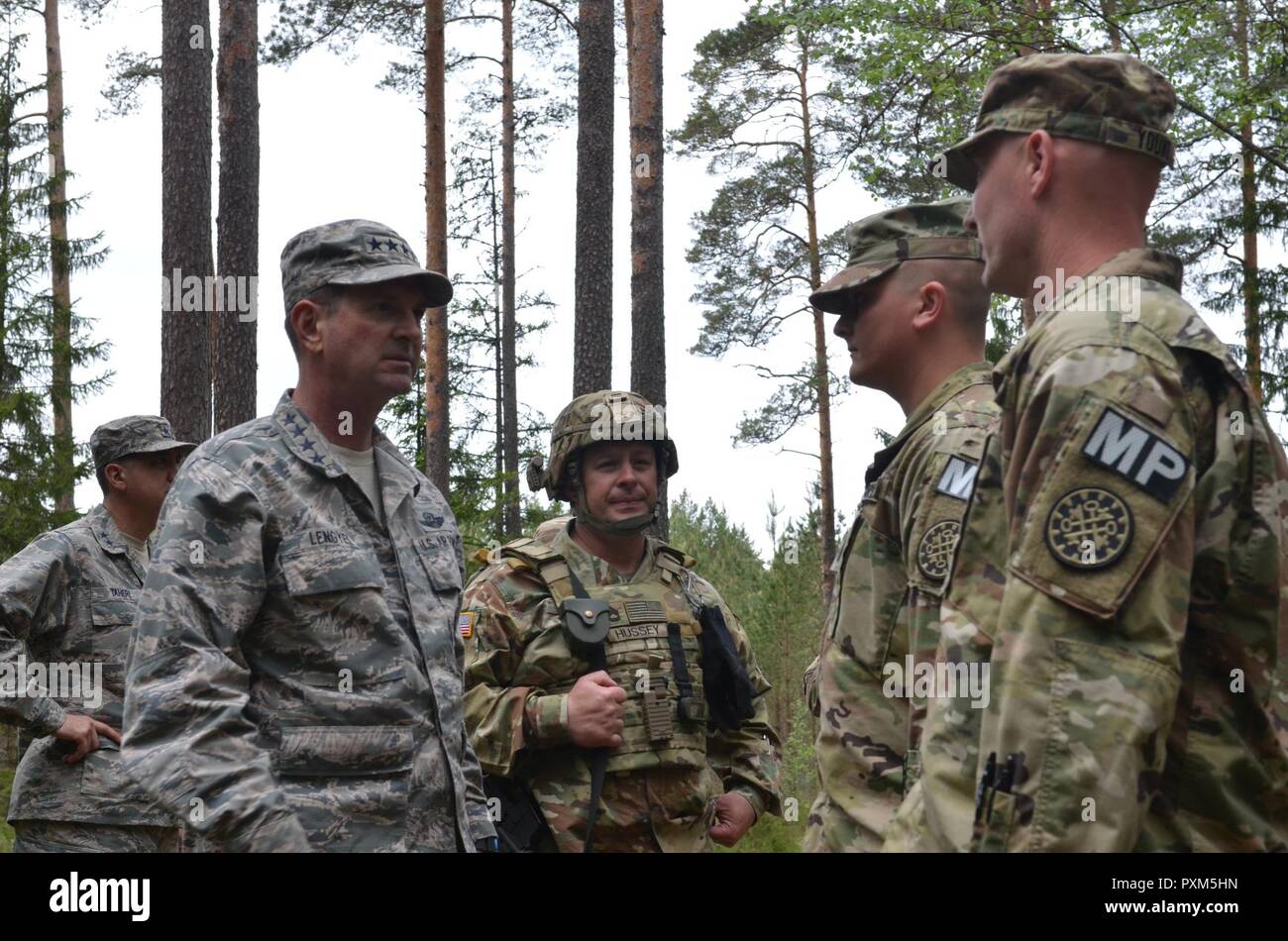 ADAZI MILITARY BASE, Latvia — U.S. Air Force Gen. Joseph L. Lengyel, Chief of the National Guard Bureau and member of the Joint Chiefs of Staff, meets with members of the 1775th Military Police Company, 210th Military Police Battalion, 177th Military Police Brigade, Michigan Army National Guard; and 3rd Battalion, 157th Field Artillery Regiment, 169th Fires Brigade, Colorado Army National Guard.  The units are in the Baltics for Exercise Saber Strike, a U.S. Army Europe led exercise in the Baltic region. The exercise tests the capability of multiple nations to act against a threat. Stock Photo