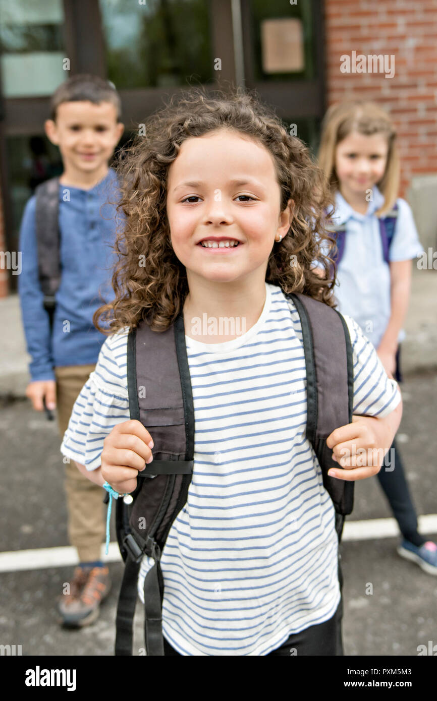 Group of students outside at school standing together Stock Photo - Alamy