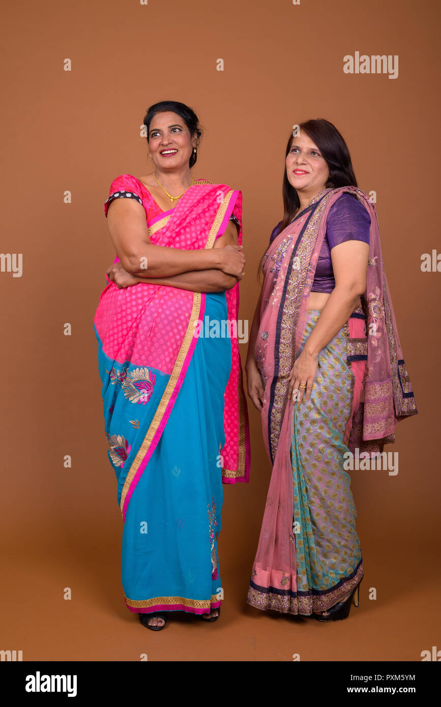 Two Mature Indian Women Wearing Sari Indian Traditional Clothes Stock