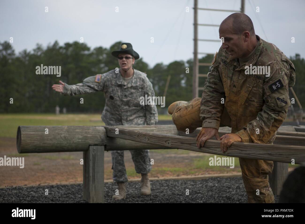 Sgt David Blalock A Cable Systems Installer Maintainer With The 481st Heavy Boat Transportation Company Port Hueneme Ca Steps Over A Wooden Beam At The End Of The High Step Over Obstacle Fort