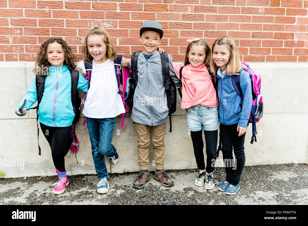 Group of students outside at school standing together Stock Photo - Alamy