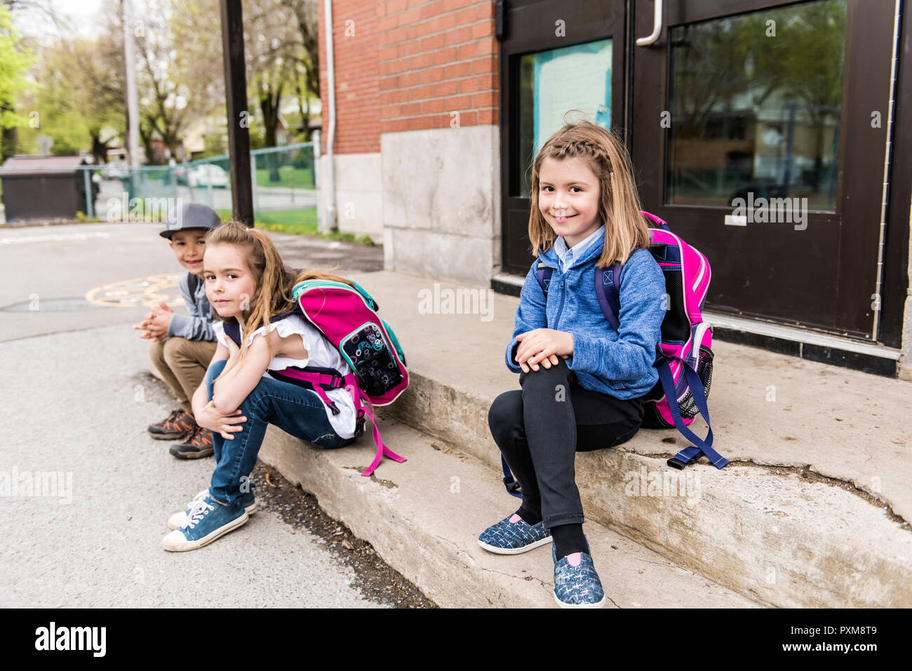 Group of students outside at school standing together Stock Photo - Alamy
