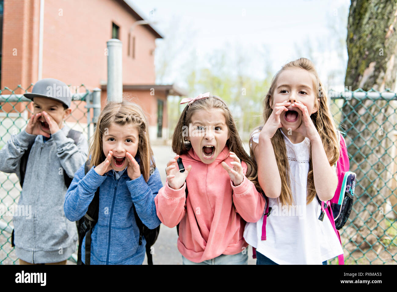 Group of students outside at school standing together Stock Photo - Alamy