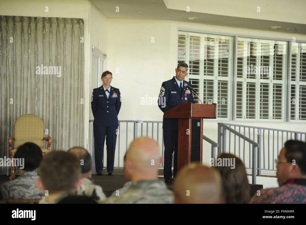 Chief Master Sgt. Brian Wong, Fourth Air Force command chief, speaks to the men and women of Fourth Air Force during his retirement ceremony, Joint Base Pearl Harbor-Hickam, Hawaii, June 12, 2017.  As the command chief, Wong was responsible for advising the commander on the health, welfare, morale, and discipline for all enlisted personnel within Fourth Air Force.  Wong retired after 35 years of service. Stock Photo