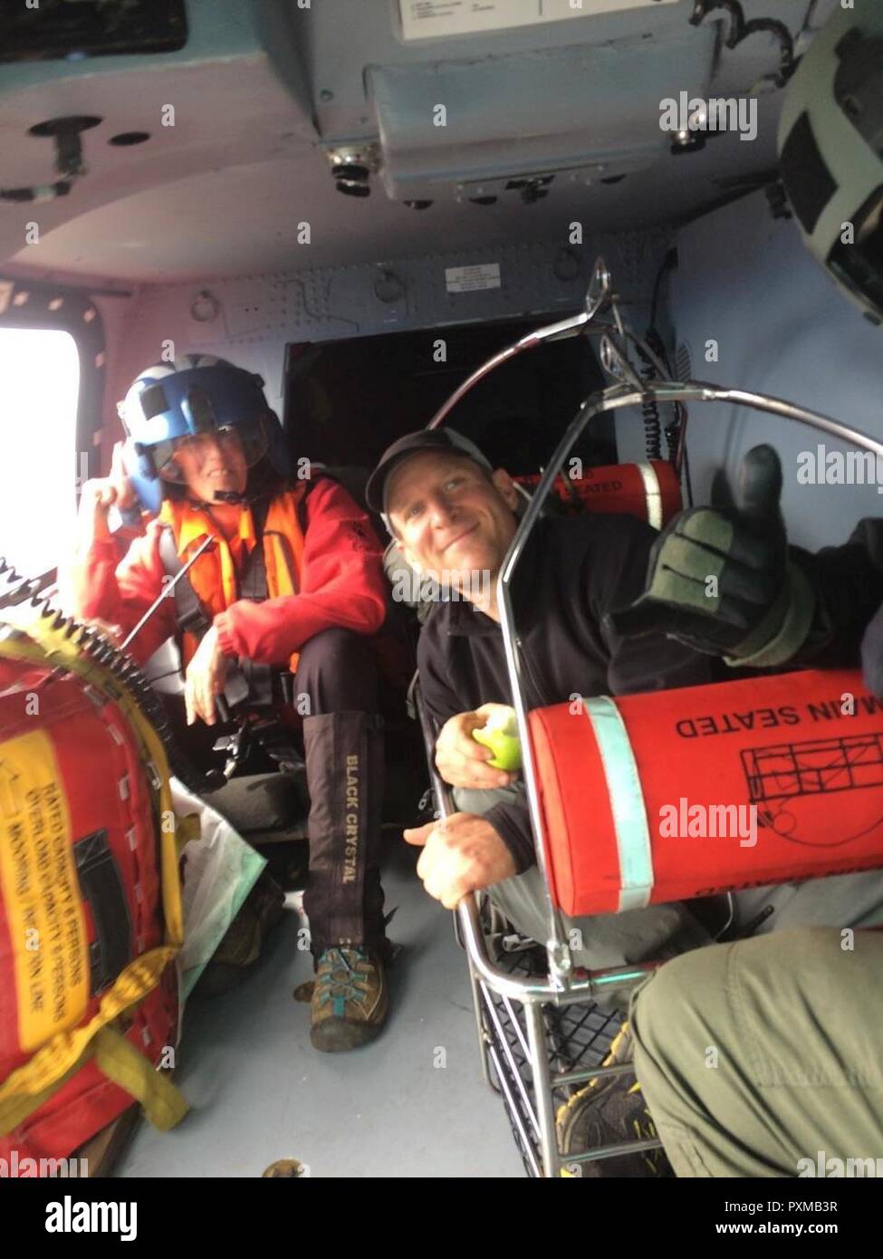 An aircrew aboard an MH-65 Dolphin helicopter rescued a hiker, who had missing for 5 days, from the Rogue River-Siskiyou National Forest, June 14, 2017.    The Coast Guard assisted partner agencies from the state of Oregon and Josephine County in locating the missing hiker and returning him home safely. Stock Photo