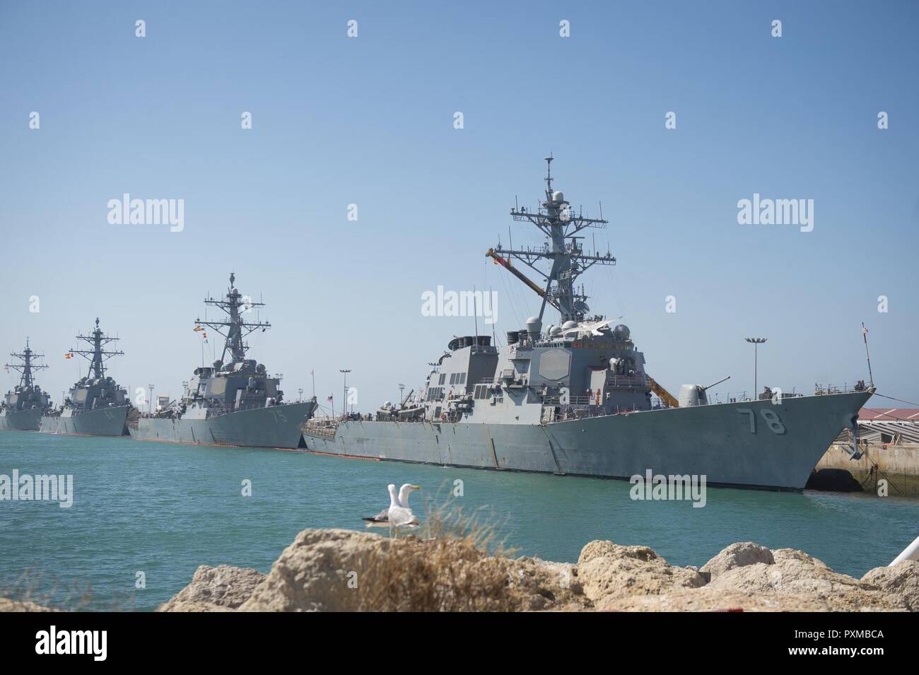 NAVAL STATION ROTA, Spain (June 13, 2017) The Arleigh Burke-class guided-missile destroyers USS Porter (DDG 78), front, USS Donald Cook (DDG 75), USS Carney (DDG 64), and USS Ross (DDG 71) moored at Naval Station Rota, Spain, June 13, 2017. Ross, forward-deployed to Rota, is conducting naval operations in the U.S. 6th Fleet area of operations in support of U.S. national security interests in Europe and Africa. Stock Photo