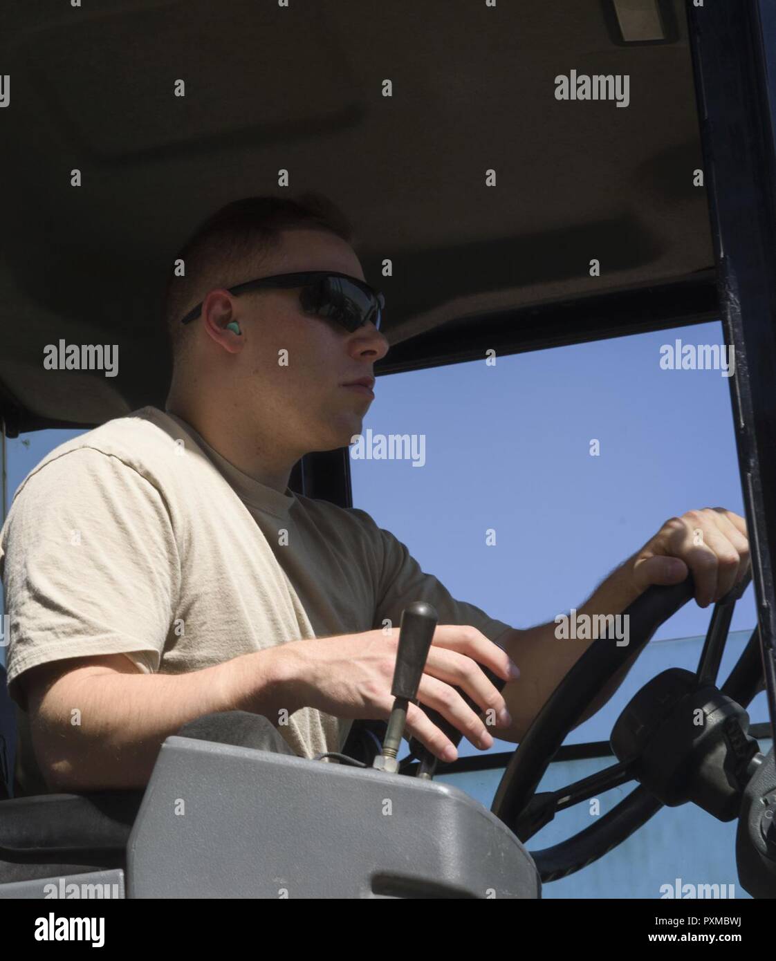 Senior Airman Giovany Tellez, 455th Expeditionary Logistics Readiness Squadron traffic management office, operates a forklift at Bagram Airfield, Afghanistan, June 13, 2017. The 455th ELRS TMO receives vast amounts of cargo each day, and utilizes various vehicles such as forklifts and flatbed trucks to get them where they need to be. Stock Photo