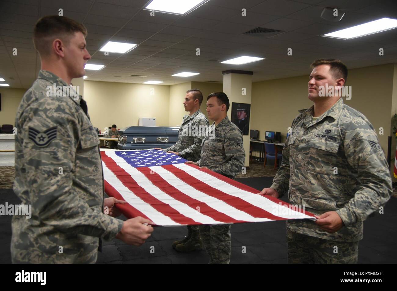 Fairchild Air Force Base honor guardsmen practice a sixman flag fold