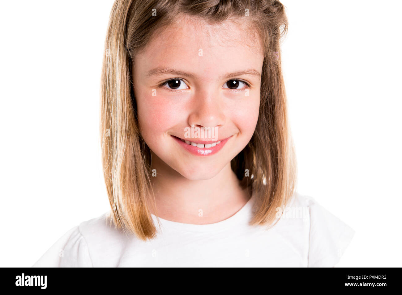 A Portrait of a cute 7 years old girl Isolated over white background Stock Photo