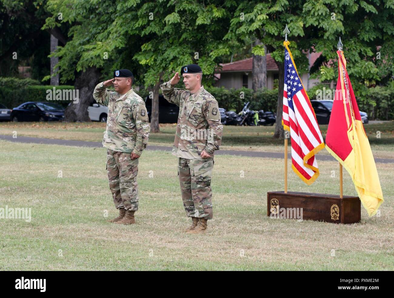 1st Sgt. Raymond B. Peredo of Yona, Guam (left) and 1st Sgt. Thomas A. Johnson of Mineral Point, Wis. (right) prepare to take part in the Headquarters and Headquarters Battery,  94th Army Air and Missile Defense Command change of responsibility ceremony June 14 at the Medal of Honor field on Joint Base Pearl Harbor-Hickam. During the ceremony Johnson assumed responsibility of HHB from Peredo. Stock Photo