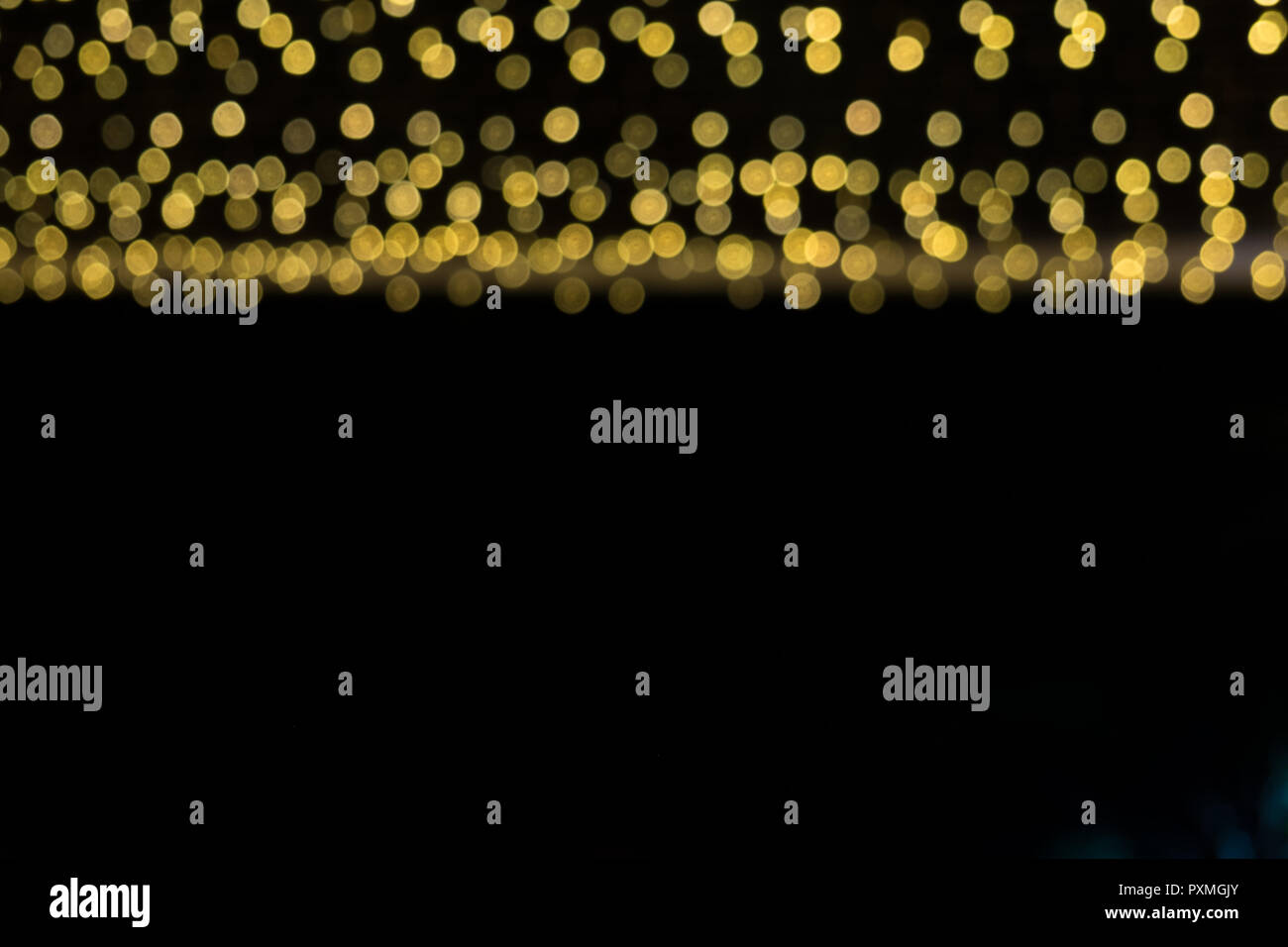 Abstract gold bokeh on the black background Stock Photo - Alamy