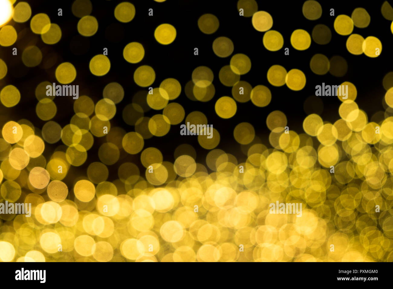 Abstract gold bokeh on the black background Stock Photo - Alamy