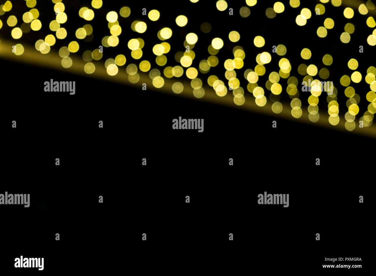 Abstract gold bokeh on the black background Stock Photo - Alamy