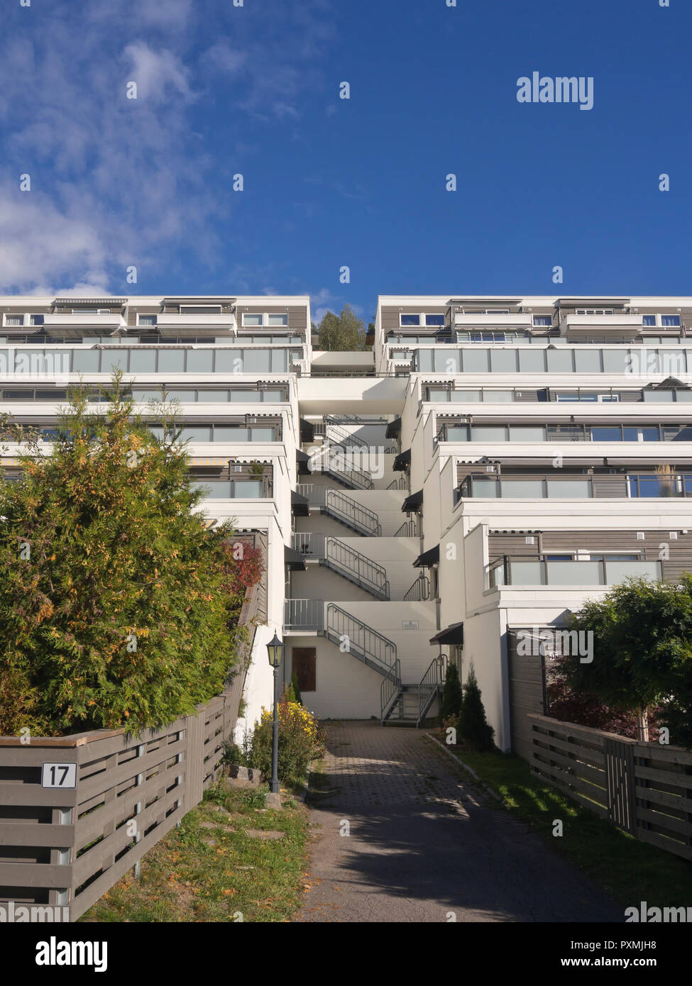Terraced apartment block in the suburb of Holmlia in Oslo Noway, popular architecture with large terraces and flowerboxes Stock Photo