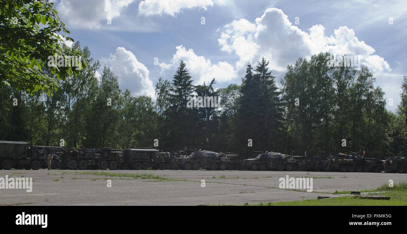 All of the vehicles in the tactical road march were staged in the assembly area once they arrived to Rukla, Lithuania after conducting a convoy across Eastern Europe, June 18, 2017, as part of Saber Strike 17. The Poland-based Battle Group conducted the convoy portion of the Field Training Exercise to demonstrate their ability to execute a forward passage of lines across the only land connection between the Baltic States of Estonia, Latvia and Lithuania, which is known as the Suwalki Gap. Stock Photo