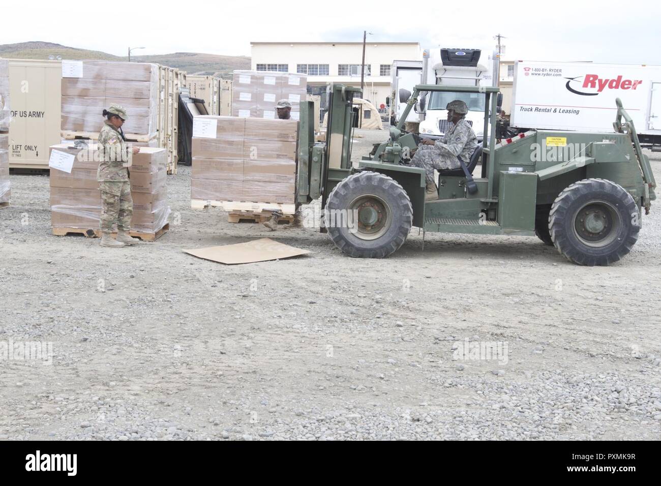 A Soldier with 46th Aviation Support Battalion moves food rations to prepare for shipment  June 16, 2017, at Yakima Traing Center, Wash. This was for Bayonet Focus 17-03, an exercise that supported approximetly 7,000 people. Stock Photo