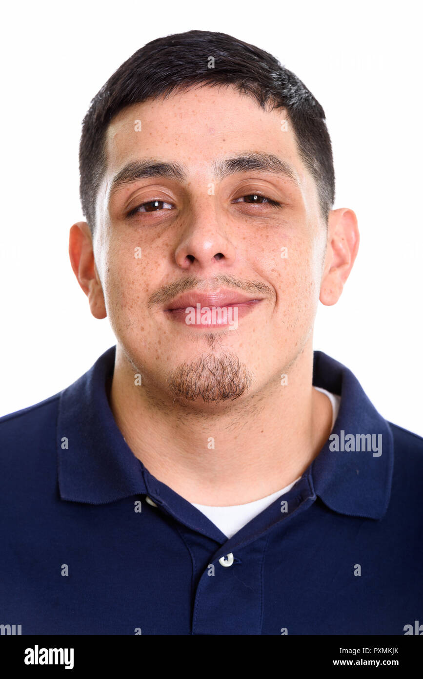 Face of young Hispanic man looking at camera Stock Photo