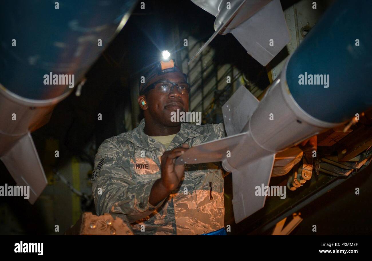 Senior Airman Ja’mouri Moye, 2nd Aircraft Maintenance Squadron load crew, ensures munitions are secure within the bomb bay of a B-52H Stratofortress at Royal Air Force Fairford, United Kingdom, June 7, 2017. Three B-52s from the 2nd Bomb Wing, Barksdale Air Force Base, La., operated out of RAF Fairford in support of exercises Arctic Challenge, BALTOPS 17 and Saber Strike 17. The B-52 is capable of dropping or launching the widest array of weapons in the U.S. inventory, including gravity bombs, cluster bombs, precision-guided missiles and joint direct attack munitions. Stock Photo