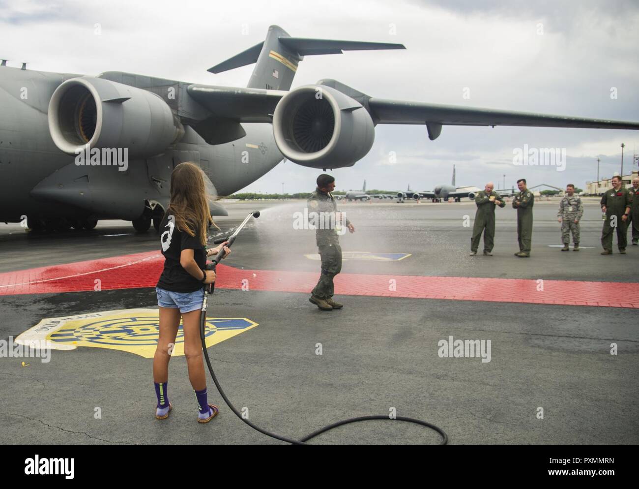 Friends and family members spray Col. Charles Velino, 15th Operations ...