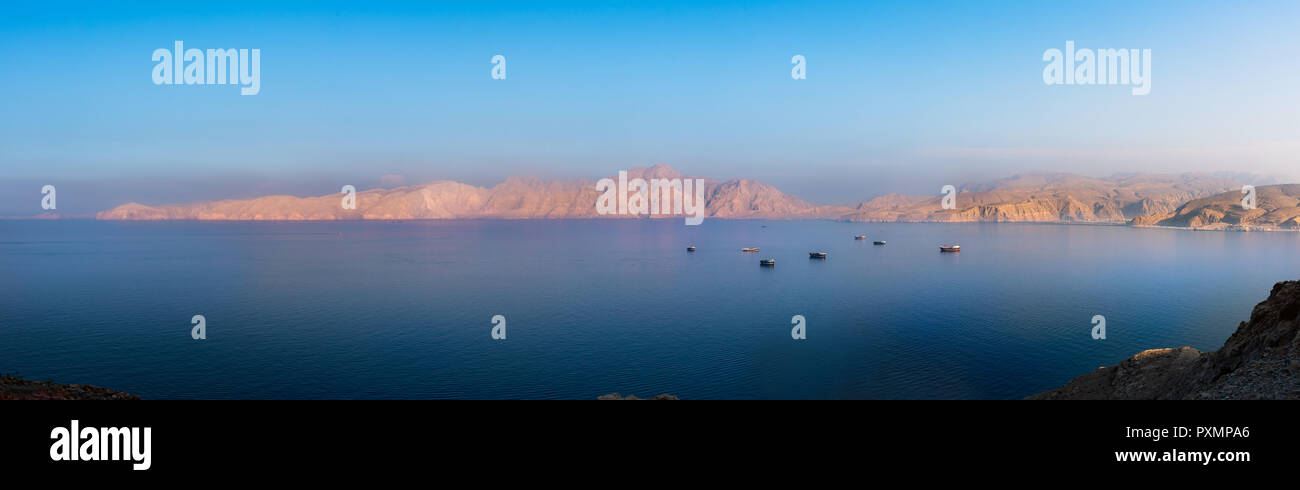 Panorama of idylic sunset over Fjords near Khasab in Oman Stock Photo