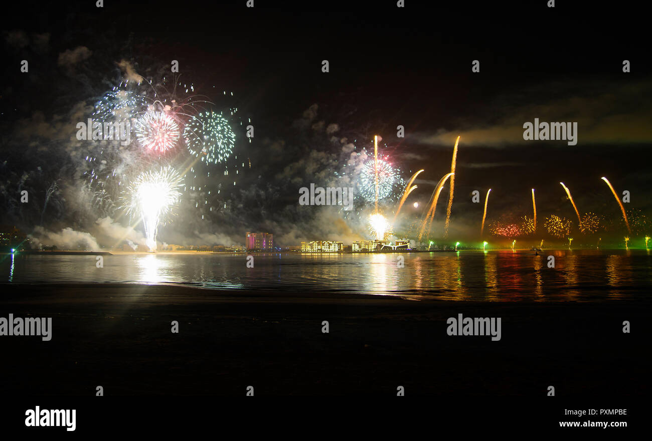 Festive firework over seaside water, celebration time Stock Photo