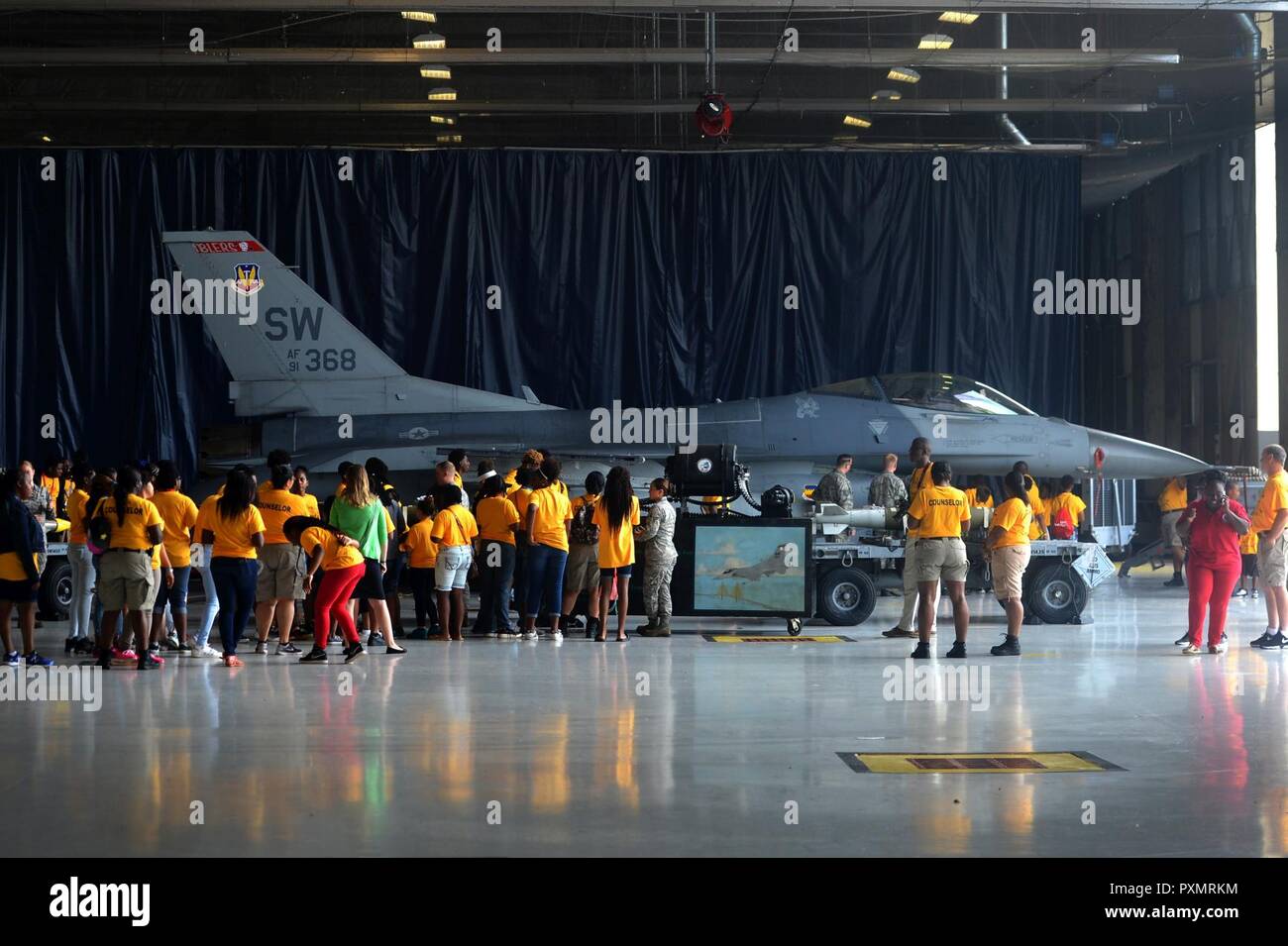 Attendees of the Sumter County Sheriff’s Office’s annual youth conference are briefed about the capabilities of the F-16CM Fighting Falcon at Shaw Air Force Base, S.C., June 16, 2017. During the conference, attendees safely interacted with a M61A1 Vulcan 20 mm rotary cannon, inert bombs and other 20th Fighter Wing weapons and equipment. Stock Photo